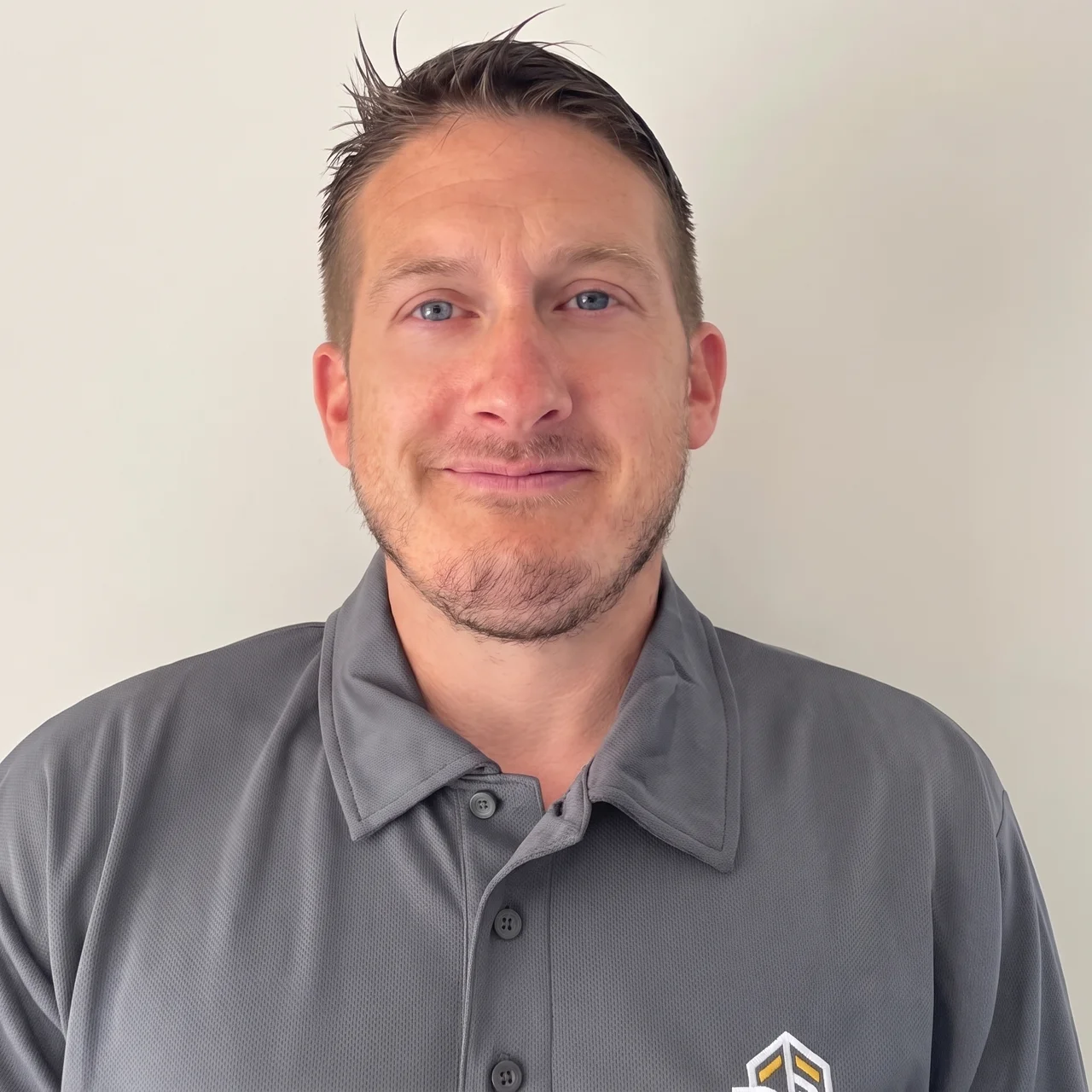 Jamie Croucher, owner of Renovate Build Landscaping, in branded workwear